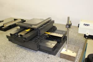 Figure 1: Precision linear stage with air bearings and direct drive with single-piece “L mirror”